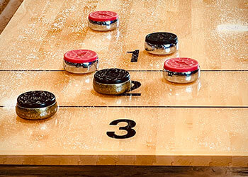 Close up view of a shuffleboard table.